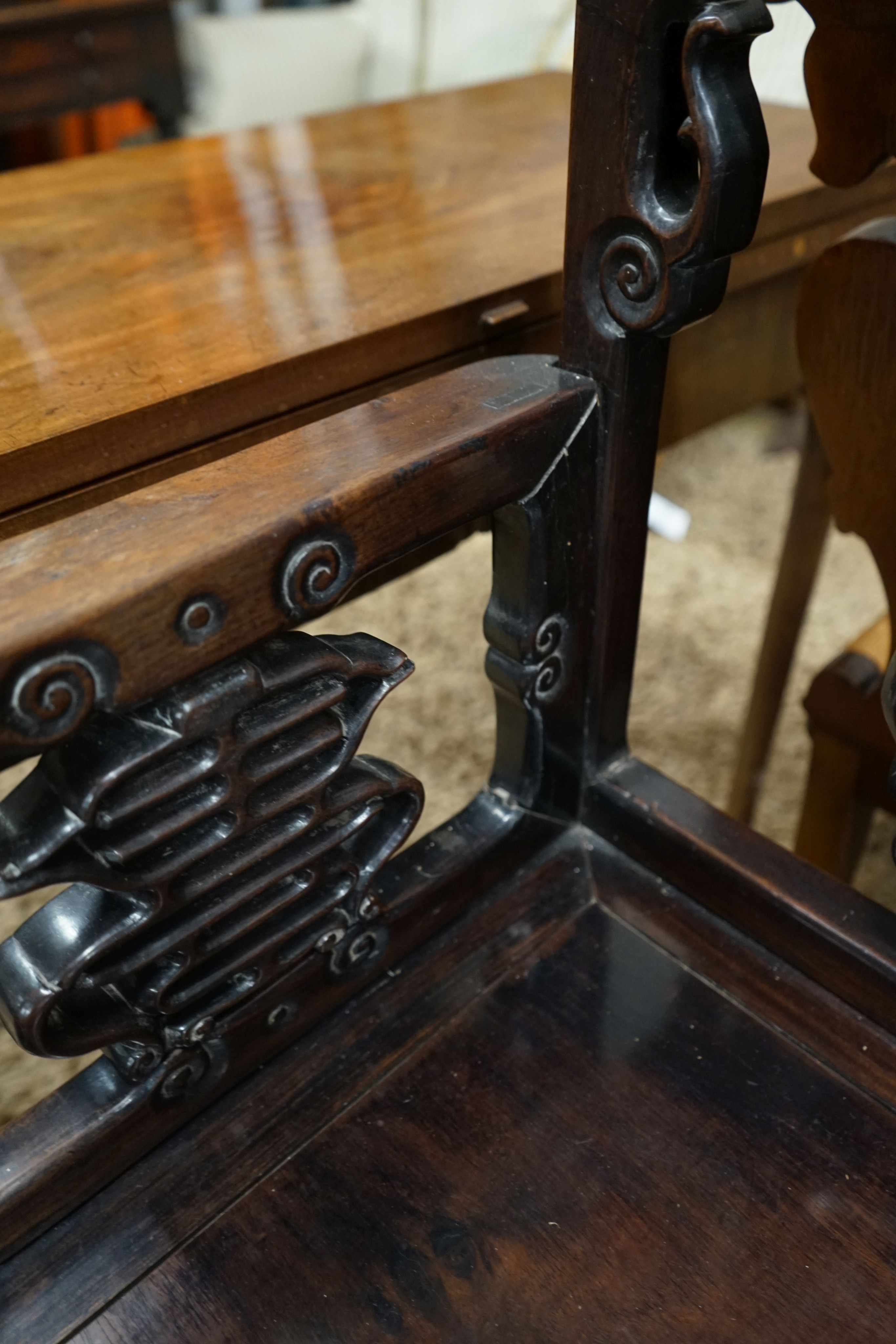 A pair of Chinese carved hongmu elbow chairs (a.f.), width 65cm, depth 48cm, height 96cm